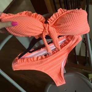 High waisted, neon coral colored bikip.nni